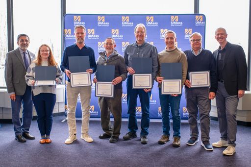 Emma Wood, Dr. Brian Williams, Dr. Mark Altabet, Dr. Kevin Stokesbury, Dr. Chad McGuire, and Dr. Kenneth Manning, joined by Dr. Ramprasad Balasubramanian and Chancellor Mark Fuller for the UMassD Research in the Media Certificate.