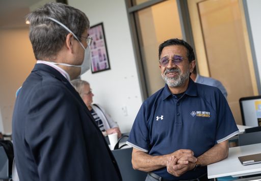 Provost Ramprasad Balasubramanian was talking to Chancellor Professor John Buck.