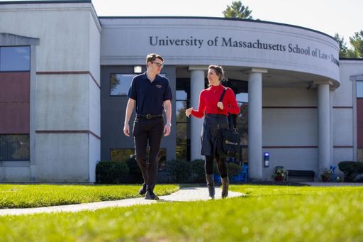 UMass Law students walking away from the UMass Law building.