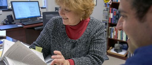 School of Law Professor Justine Dunlap meeting with student