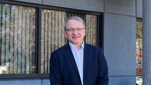 Standing in front of law clinics building