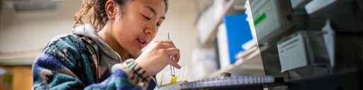 Graduate student, Ronni Mak, conducting research