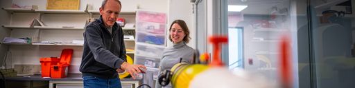 Professor Daniel MacDonald and PhD student, Agata Piffer Braga, working on an autonomous underwater vehicle (AUV)