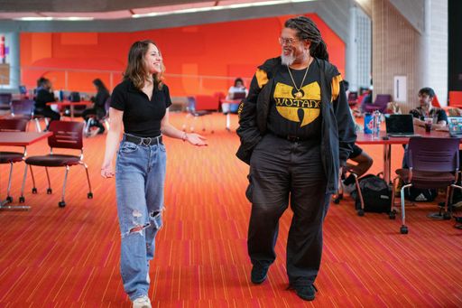 Professor Mwalim Peters and student, Crystalis Lavergne '25, Graphic Design (major), marketing (minor)