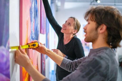 Professor Elena Peteva and Drawing student, Connor Chan '24 working on an installation in the CVPA gallery