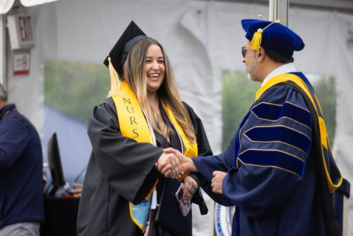 Student shaking hands at graduation