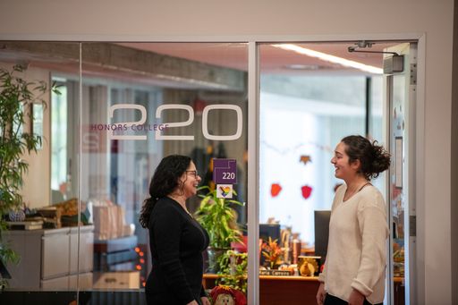 Amy Shapiro standing outside the Honors College office with Fiona Marques '25: Integrated Studio Arts, Psychology (majors)
