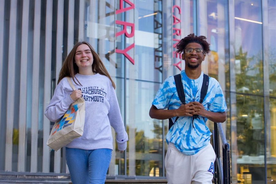 two students in front of library