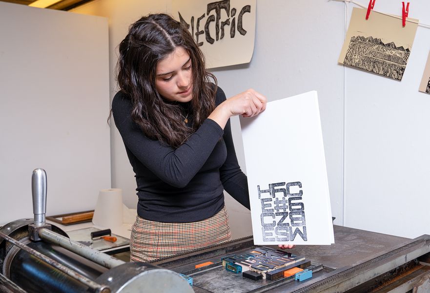 Graphic Design student, Alyxandra Vieira '23, in the printmaking studio
