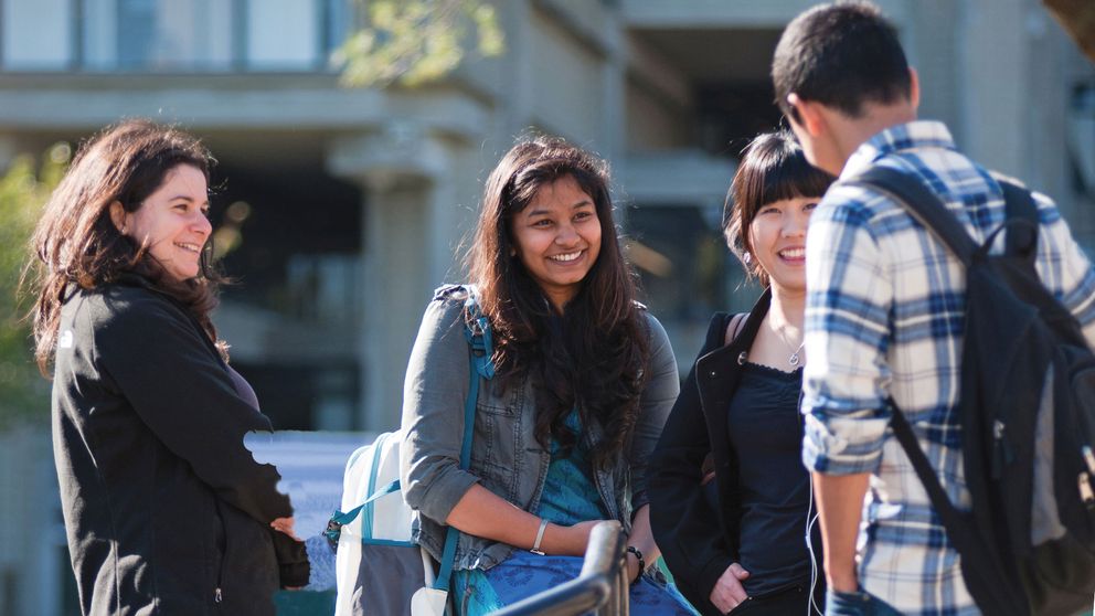 UMassD students meeting outdoors in the campus quad