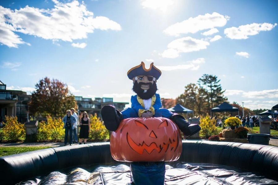 Arnie the Corsair sits atop a giant inflatable pumpkin at the Blue & Gold Family Festival