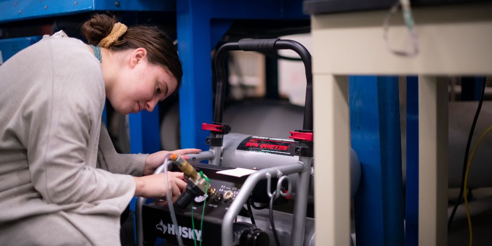 FSI lab student working on a generator
