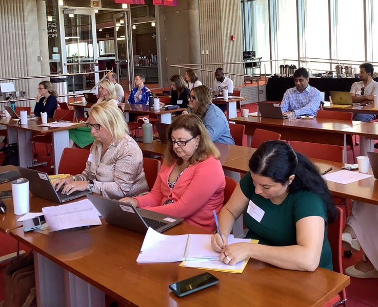 Group of people attending an event and working.