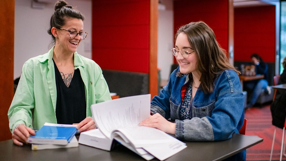 A graduate student and undergraduate student in conversation