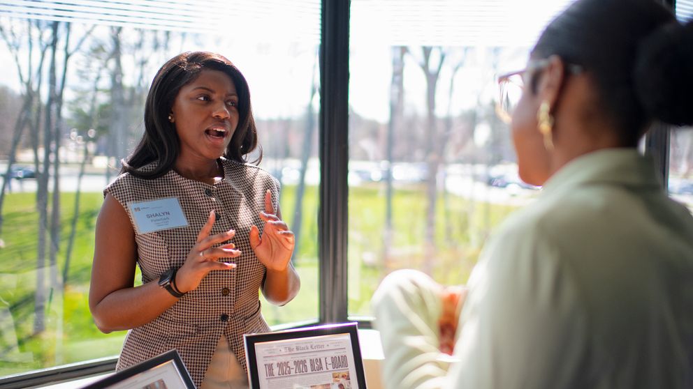 Student discussing their work at Scholarship Day.