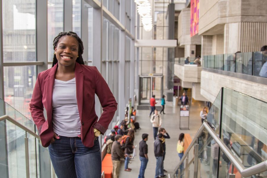 Smiling student at top of stairs