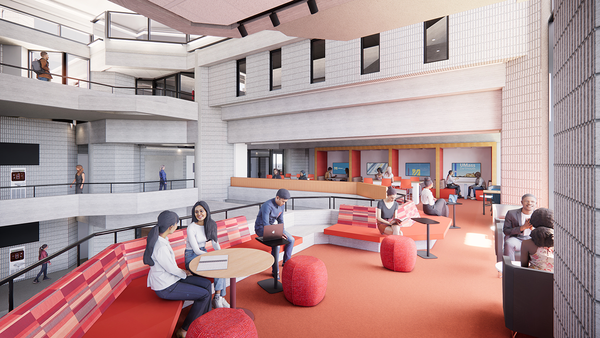 Students interacting in small groups in an open area